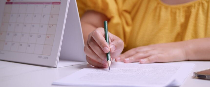 Woman writing on a notepad
