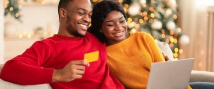 A couple online holiday shopping