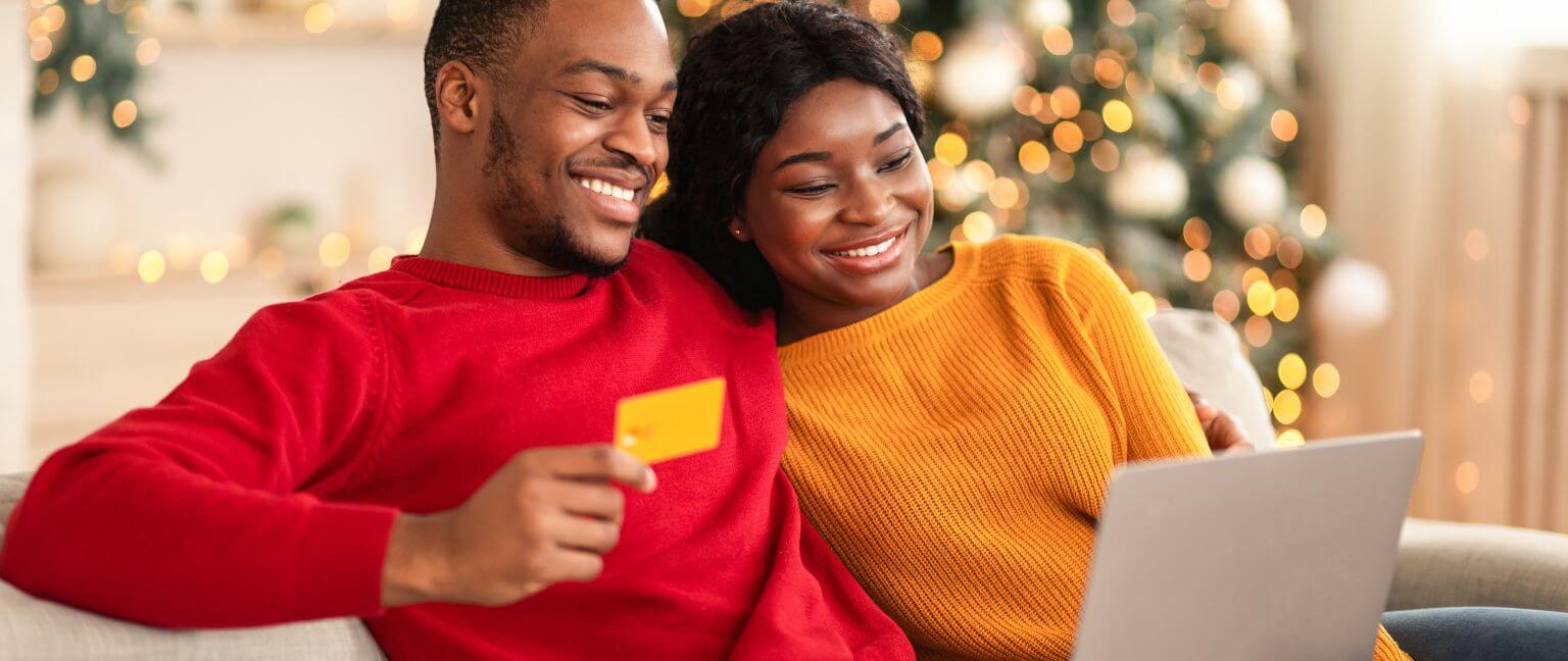 A couple online holiday shopping