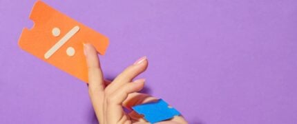 Hand holding a coupon