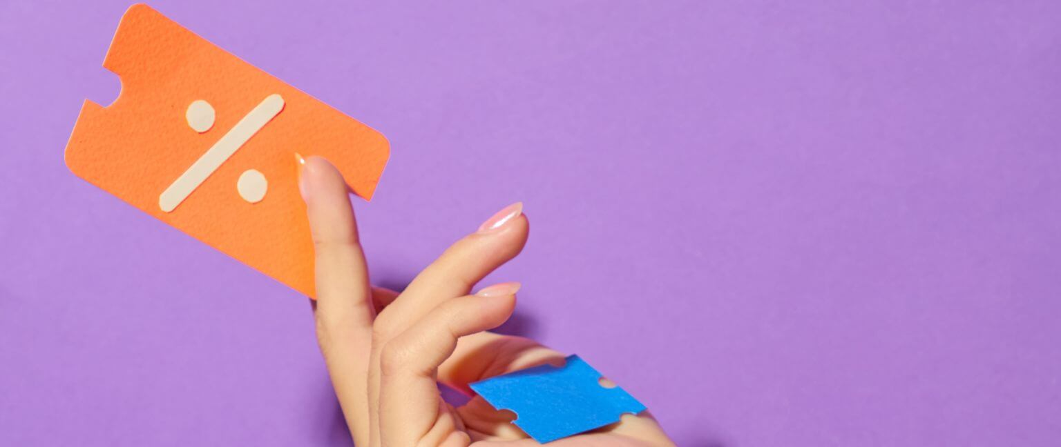 Hand holding a coupon