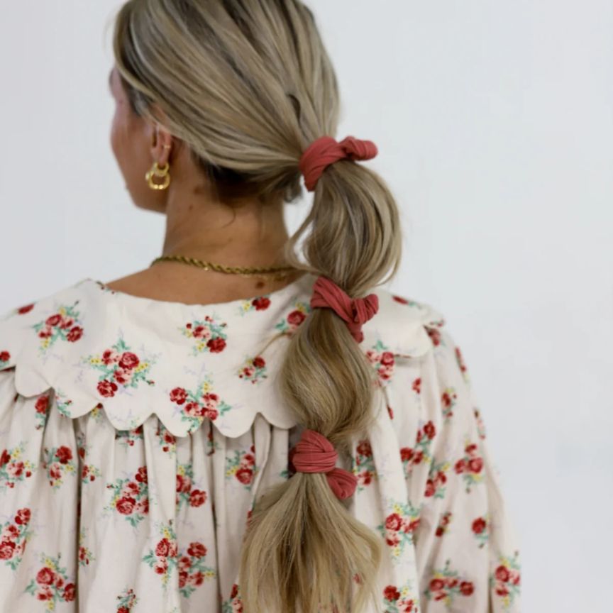 woman wearing scrunchies in her hair